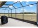 Screened in patio features views to the property beyond at 9581 Sw 63Rd Loop, Ocala, FL 34481
