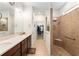 Large main bathroom featuring double sink vanity, walk-in shower and walk-in closet at 9581 Sw 63Rd Loop, Ocala, FL 34481