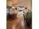 Inviting dining area with a view into the kitchen, featuring a stylish light fixture and laminate flooring at 9638 Sw 94Th Ct # A, Ocala, FL 34481