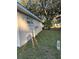 Back of house exterior surrounded by lush greenery at 9638 Sw 94Th Ct # A, Ocala, FL 34481