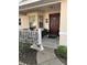 Cozy front porch with decorative plants, leading to a welcoming front door and covered entry at 9638 Sw 94Th Ct # A, Ocala, FL 34481