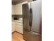 Kitchen featuring a stainless steel refrigerator and light colored cabinets at 9638 Sw 94Th Ct # A, Ocala, FL 34481