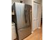 Updated kitchen featuring a stainless steel refrigerator and closet doors at 9638 Sw 94Th Ct # A, Ocala, FL 34481