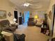 Bright living room with an open layout, ceiling fan and lots of space for entertaining at 9638 Sw 94Th Ct # A, Ocala, FL 34481