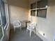 Cozy patio with a pair of chairs and a table, perfect for enjoying fresh air at 9638 Sw 94Th Ct # A, Ocala, FL 34481