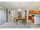 Inviting dining area adjacent to the kitchen, showcasing natural light and comfortable seating at 9704 Sw 95Th Loop, Ocala, FL 34481