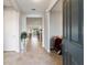 Bright foyer featuring tile flooring and views into the living spaces at 9704 Sw 95Th Loop, Ocala, FL 34481