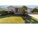 Charming home with manicured lawn, lush landscaping, and inviting curb appeal at 9704 Sw 95Th Loop, Ocala, FL 34481