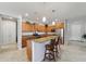 Spacious kitchen featuring granite countertops, pendant lighting, and stainless steel appliances at 9704 Sw 95Th Loop, Ocala, FL 34481