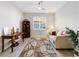 Comfortable living room featuring tile floors, a window, neutral paint and a ceiling fan at 9704 Sw 95Th Loop, Ocala, FL 34481