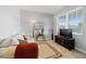 Cozy living room with a comfortable couch, a TV, and natural light at 9704 Sw 95Th Loop, Ocala, FL 34481