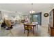 Open-concept living area featuring neutral colors, large windows, and a comfortable seating arrangement at 9704 Sw 95Th Loop, Ocala, FL 34481