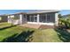 Backyard features a brick patio under a screened lanai at 9704 Sw 95Th Loop, Ocala, FL 34481
