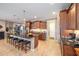 Open kitchen with granite counters, stainless appliances, and a breakfast bar with seating for five at 9895 Sw 95Th Loop, Ocala, FL 34481
