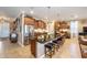 Spacious kitchen featuring a large island with seating, granite countertops, and stainless steel appliances at 9895 Sw 95Th Loop, Ocala, FL 34481