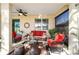 Inviting screened lanai with comfortable seating, coffee table, and outdoor lighting at 9895 Sw 95Th Loop, Ocala, FL 34481
