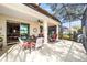 Spacious screened lanai with seating and dining area, perfect for outdoor entertaining at 9895 Sw 95Th Loop, Ocala, FL 34481