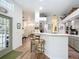 Kitchen view showcasing bar seating, a modern design and ample natural light at 9910 Sw 189Th Cir, Dunnellon, FL 34432