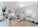 Bedroom featuring luxury vinyl flooring and ceiling fan at 10080 Se 68Th Ct, Belleview, FL 34420