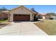 Charming single-story home featuring a well-manicured lawn and an attached two-car garage at 10080 Se 68Th Ct, Belleview, FL 34420