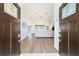 Bright and airy foyer showcasing hardwood floors and seamless flow to the living spaces at 10080 Se 68Th Ct, Belleview, FL 34420