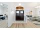 Bright and airy foyer showcasing hardwood floors and seamless flow to the living spaces at 10080 Se 68Th Ct, Belleview, FL 34420