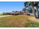 Charming single-story home featuring a well-manicured lawn and an attached two-car garage at 10080 Se 68Th Ct, Belleview, FL 34420