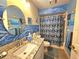 Nautical themed bathroom with granite countertop, blue accents and tiled floors at 10823 Sw 83Rd Ave, Ocala, FL 34481