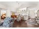 Open concept dining area with cathedral ceilings and elegant chandelier fixture at 11221 Sw 71St Ct, Ocala, FL 34476