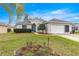 Charming single-story home featuring a well-maintained lawn and a two-car garage at 11221 Sw 71St Ct, Ocala, FL 34476