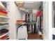 Walk-in closet with ample shelving and storage for clothing and accessories at 11221 Sw 71St Ct, Ocala, FL 34476