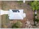 Aerial view of the house showcasing a new roof with solar panels at 12164 Se 85Th Ct, Belleview, FL 34420