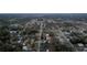 An aerial view of a residential community with tree lined streets and scattered single Gathering homes at 12164 Se 85Th Ct, Belleview, FL 34420