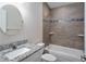 Bright bathroom with granite countertops and a tiled shower and tub at 12164 Se 85Th Ct, Belleview, FL 34420