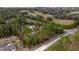 Aerial view of a spacious lot with mature trees, a single-Gathering home, and a long driveway at 12330 Sw 43 St Rd, Ocala, FL 34481