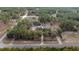 Aerial view of home, detached garage, pool and landscaping on large lot at 12330 Sw 43 St Rd, Ocala, FL 34481