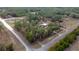 Aerial view of property surrounded by trees, neighborhood, and nearby roads at 12330 Sw 43 St Rd, Ocala, FL 34481