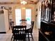 Kitchen table with chairs in front of glass paneled doors to backyard patio at 12330 Sw 43 St Rd, Ocala, FL 34481