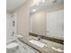 Bathroom featuring a granite countertop vanity, toilet, and shower/tub combo at 14 Water Track Ct, Ocala, FL 34472