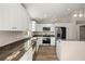 Modern kitchen featuring stainless steel appliances, granite countertops, and ample cabinet space at 14 Water Track Ct, Ocala, FL 34472