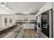 Modern kitchen featuring stainless steel appliances, granite countertops, and ample cabinet space at 14 Water Track Ct, Ocala, FL 34472