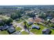 Aerial view of a community, showcasing homes and their lush, green surroundings at 14560 Sw 25Th Ter, Ocala, FL 34473