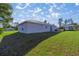 Spacious backyard view, featuring the back exterior of the house, yard, and shed at 14560 Sw 25Th Ter, Ocala, FL 34473