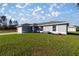 Landscaped front yard features fresh sod and mulch, with a home in the background at 14560 Sw 25Th Ter, Ocala, FL 34473