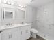 Bathroom features marble tile in the shower, double sinks, and bright vanity lighting at 15850 Sw 33Rd Avenue Rd, Ocala, FL 34473