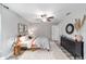 Inviting bedroom featuring ceiling fan, soft lighting, and stylish decor at 17094 Sw 39Th Cir, Ocala, FL 34473