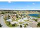 An aerial view of the home in a vibrant community with manicured lawns and mature trees at 17755 Se 117Th Cir, Summerfield, FL 34491