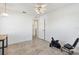 Bright room featuring neutral tile, and views into another room through the door at 17755 Se 117Th Cir, Summerfield, FL 34491