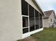 Exterior view of screened-in patio showcasing the outdoor living space and the property's architectural details at 1917 Nw 50Th Cir, Ocala, FL 34482