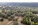 An aerial view of expansive acreage with trees and a home in the center of the lot at 2045 Marion County Rd, Weirsdale, FL 32195